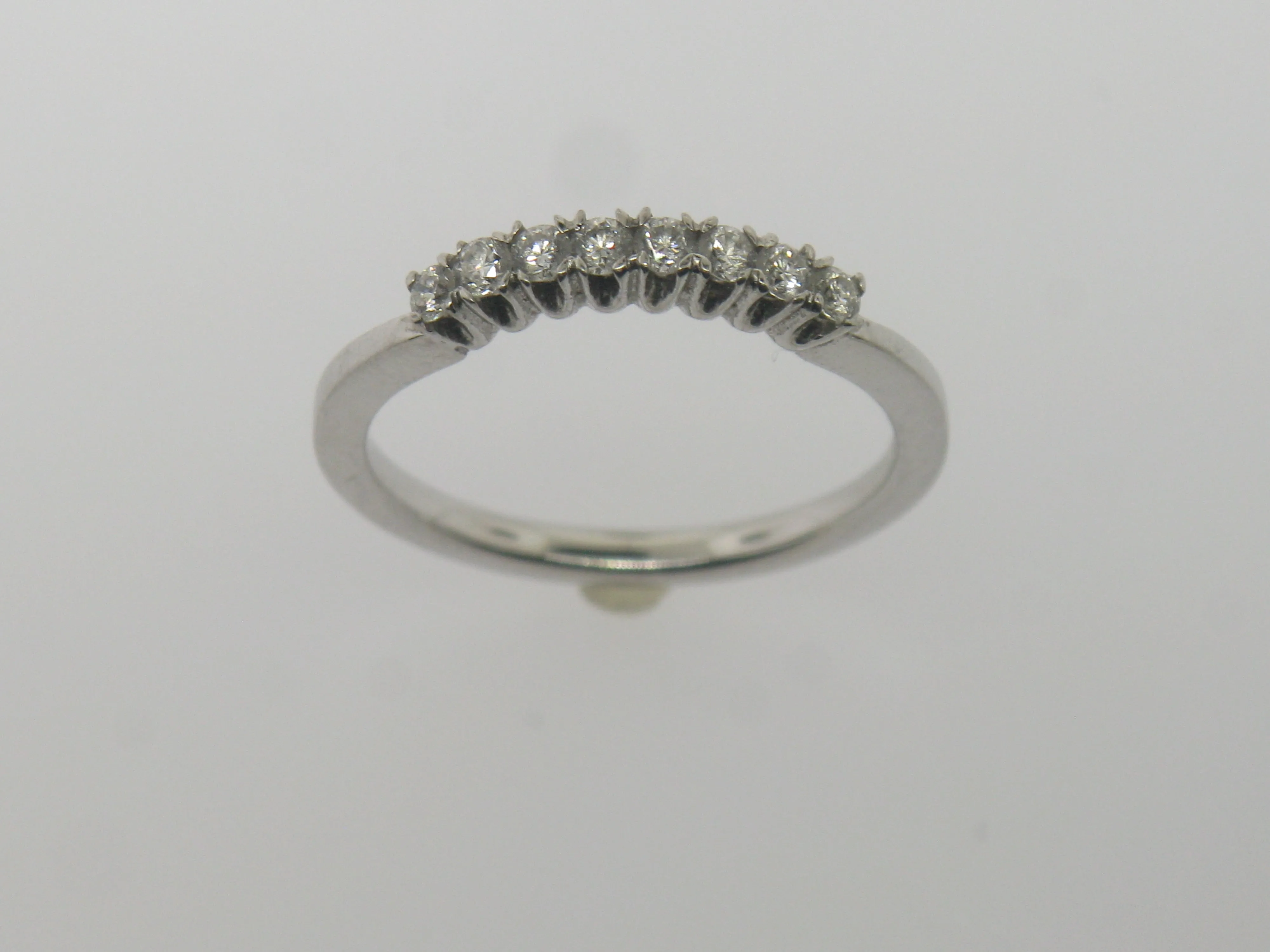 Platinum Curved Diamond Band with 8 Diamonds .28TW Size 6.75 (Brand New)